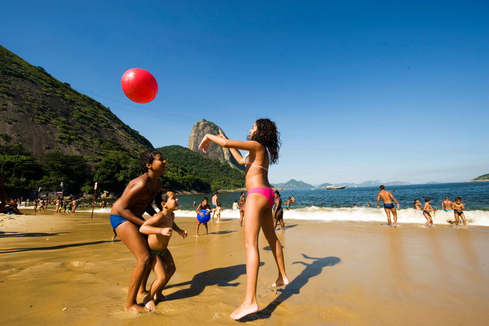 Families playing at the beach, Rio de Janeiro, Brazil