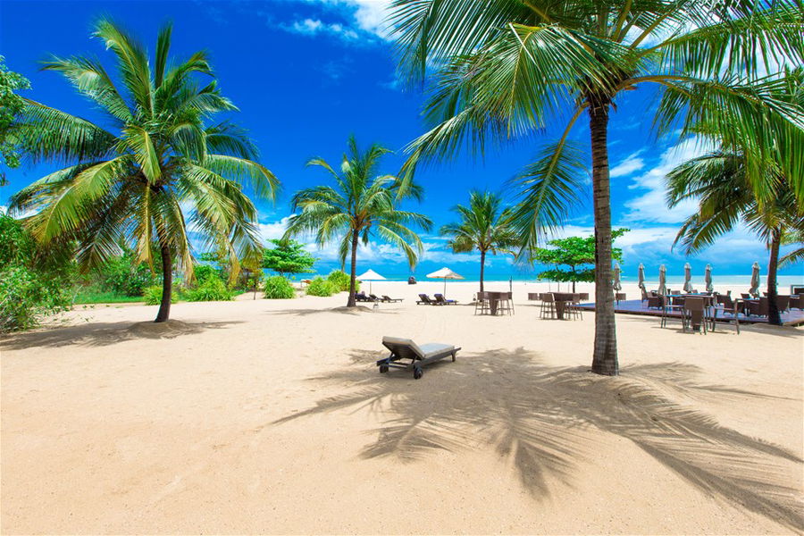 Sunloungers on a beautiful white sand beach in Bali