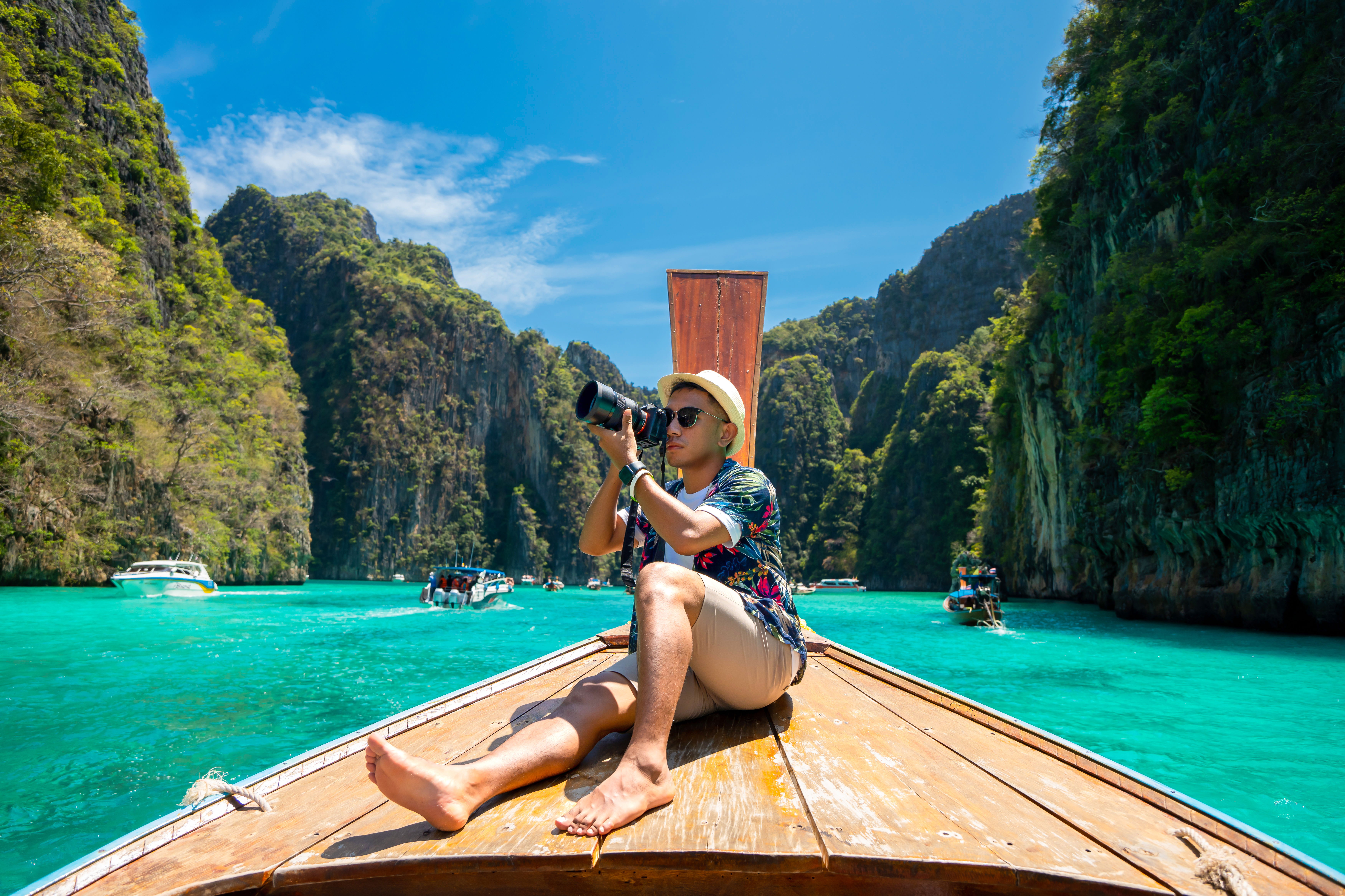 A man on a longtail boat in Thailand