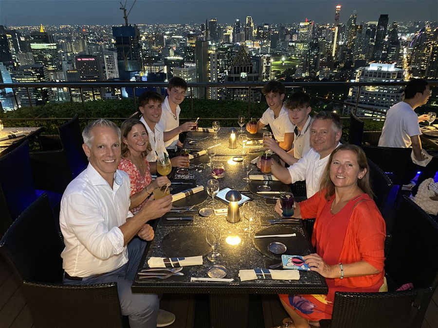 Toby having drinks on a rooftop bar in Bangkok with his family