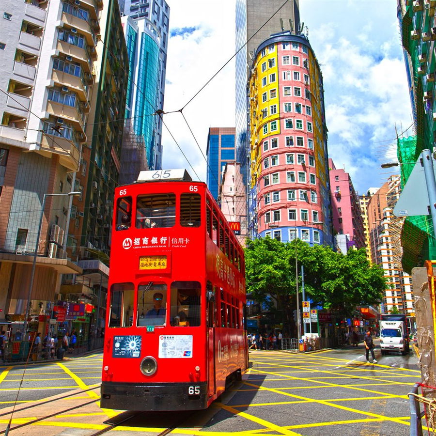 A tram drives through the streets of Hong Kong