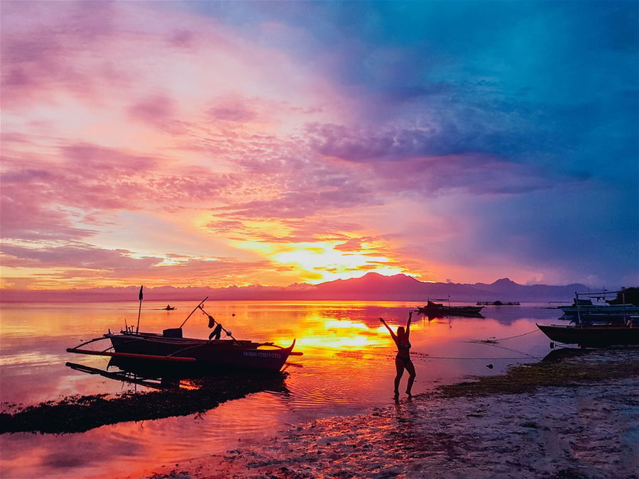 A beach at sunset in the Philippines