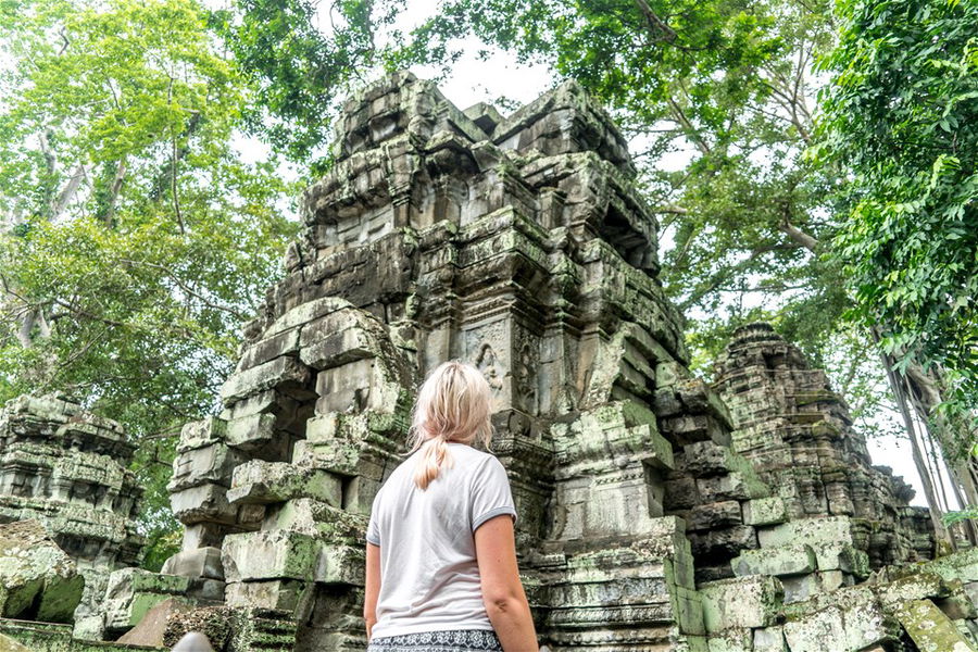 A traveller exploring the temples of Angkor Wat in Cambodia