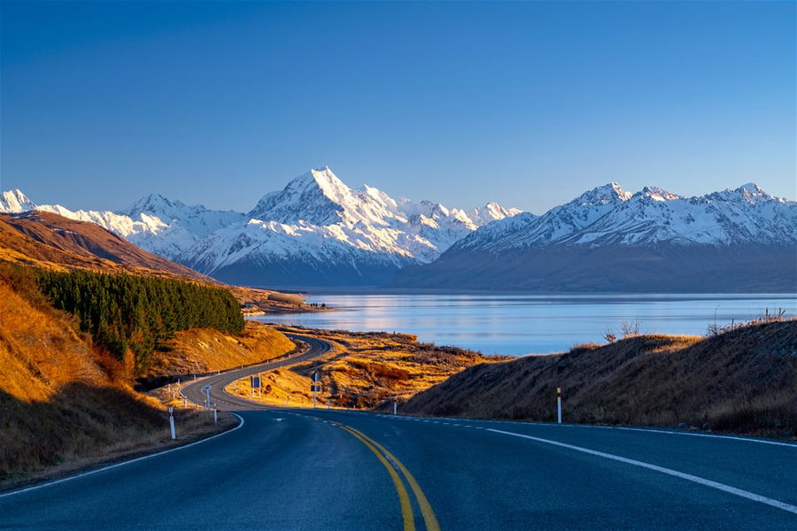 Scenic winding road along Lake Pukaki to Mount Cook National Park, South Island, New Zealand