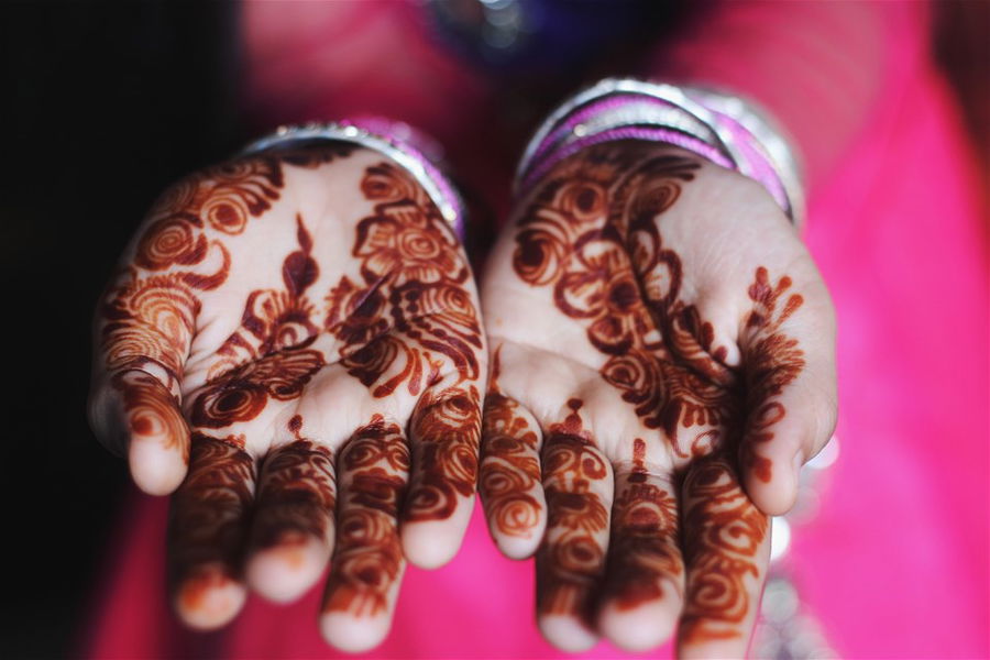 A pair of hands covered in henna tattoos, Mauritius