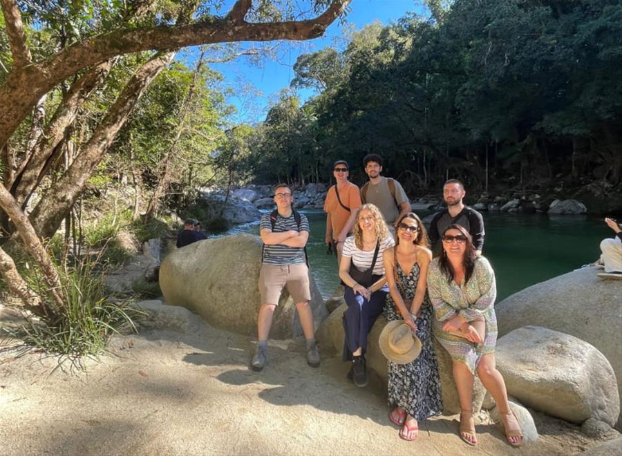 A group leaning on rocks in Queensland, Australia