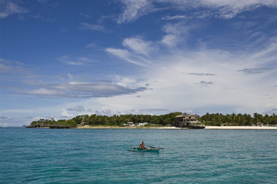 A distant beach viewed from out at sea in the Philippines