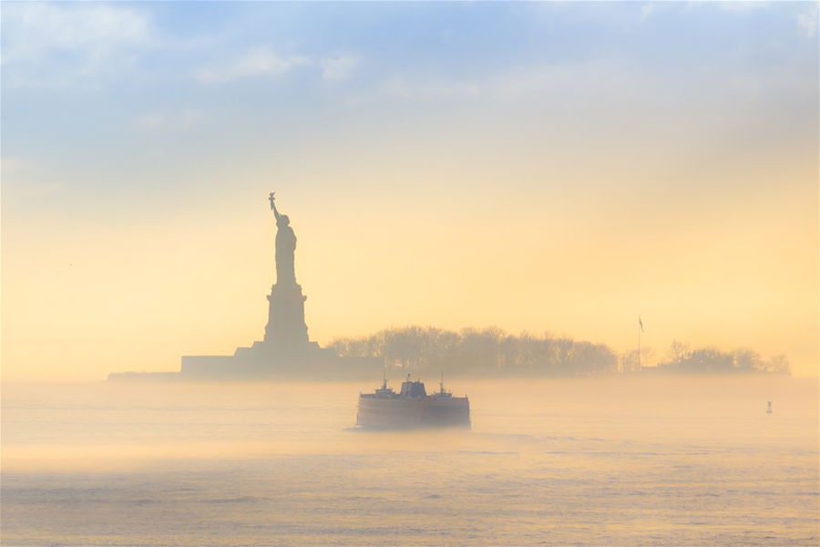 The Statue of Liberty surrounded by fog, New York