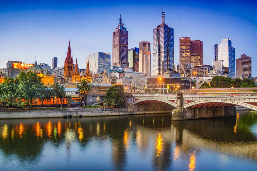 Melbourne skyline and Princes bridge with the Yarra river at dusk, Australia.