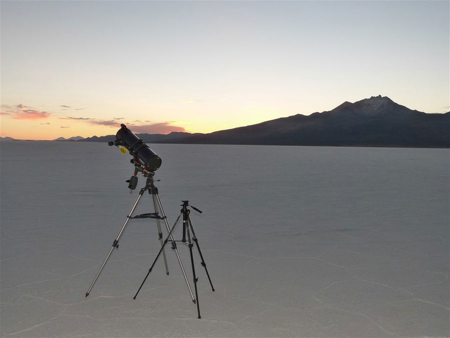 A telescope pointing to the night sky on the salt flats in Bolivia