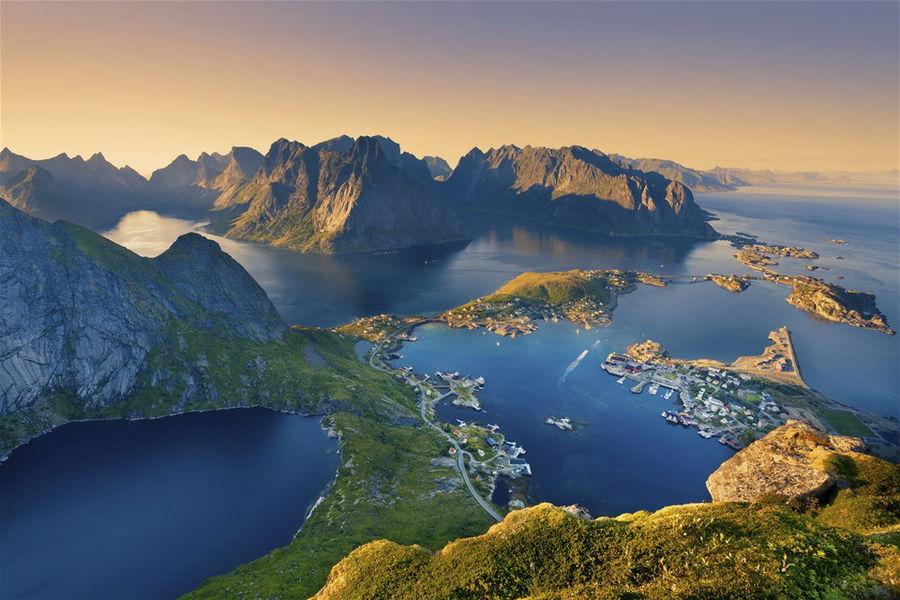 View from Reinebringen at Lofoten Islands, located in Norway, during summer sunset.