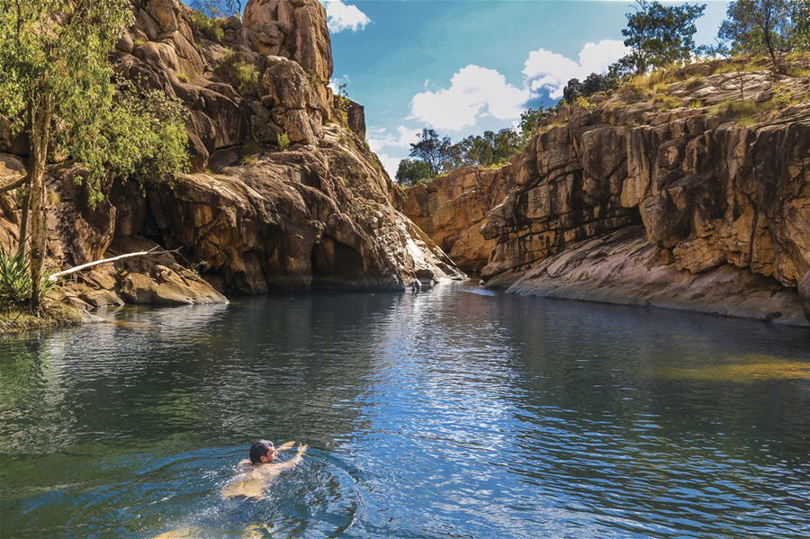 A swimmer in a beautiful natural pool in Kakadu National Park, Australia