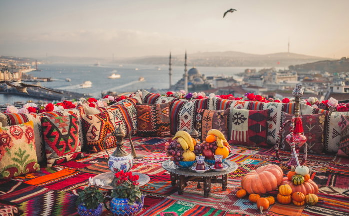 Great panoramic view of Istanbul from high terrace decorated traditional colorful ornamental pillows, Turkey