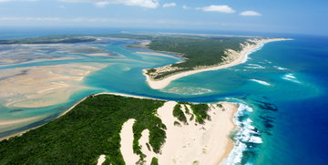 Vast views of turquoise ocean and lush tropical islands around Mozambique, Africa.