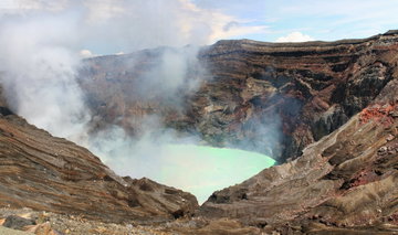 The steaming sulphuric Aso Nakadake Crater on Mount Aso in Kyushu, Japan.