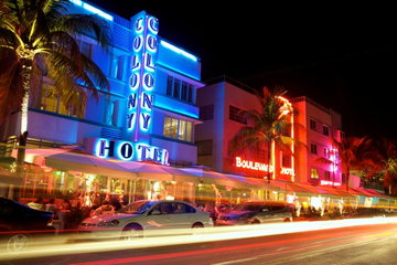 The illuminated hotel buildings of South Beach light up a warm evening in Miami, Florida, USA