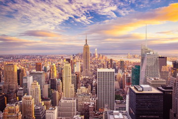 The many incredible buildings of New York City, USA, stretch out as far as you can see, such as the Empire State Building at Sunset