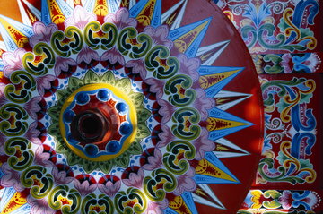 A close up of the side of a brightly coloured hand painted traditional Costa Rican oxcarts (Las carretas), Costa Rica