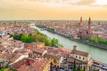Sunrise over Verona with view of the river and red rooftops in Italy