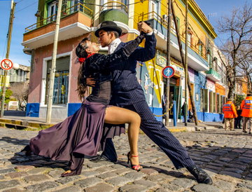 A couple dance the tango on a colourful street in Buenos Aires, Argentina