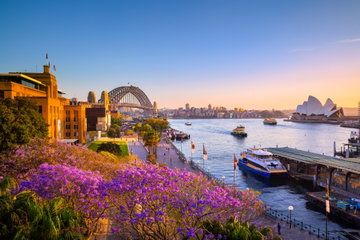 Sydney Harbour and the Harbour Bridge at sunset with the tranquil water below, Australia