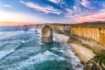 Aerial view of the Twelve Apostles and the cliffside leading to beaches and the sea below, Great Ocean Road, Australia