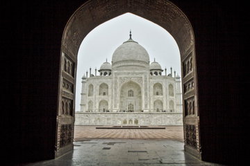 View of the beautiful and majestic Taj Mahal through the grand red sandstone entrance, Agra, India