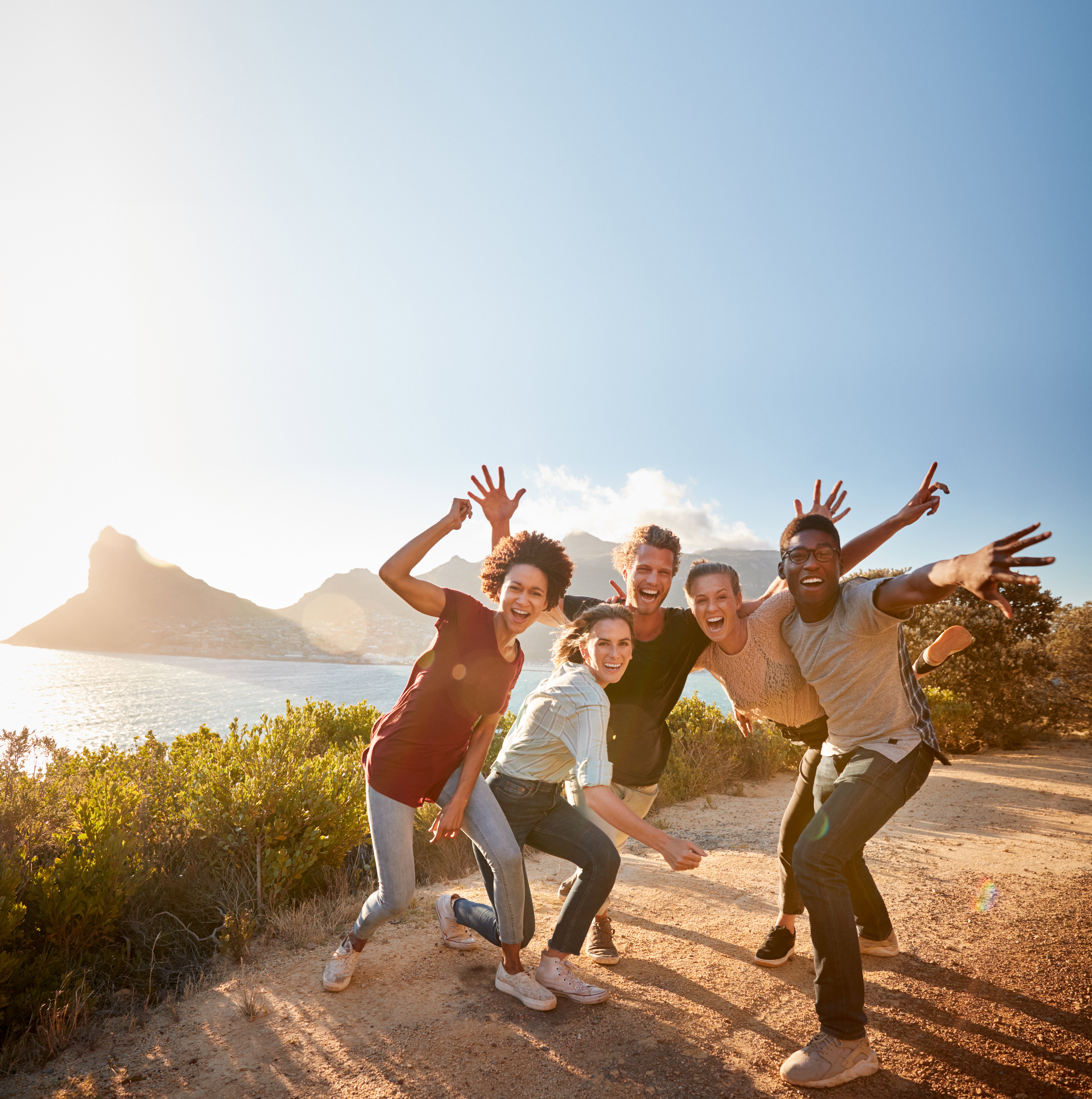 Friends on a road trip on a coastal path, Cape Town, South Africa