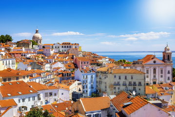 Brightly coloured houses surround the main square in Lisbon, Portugal