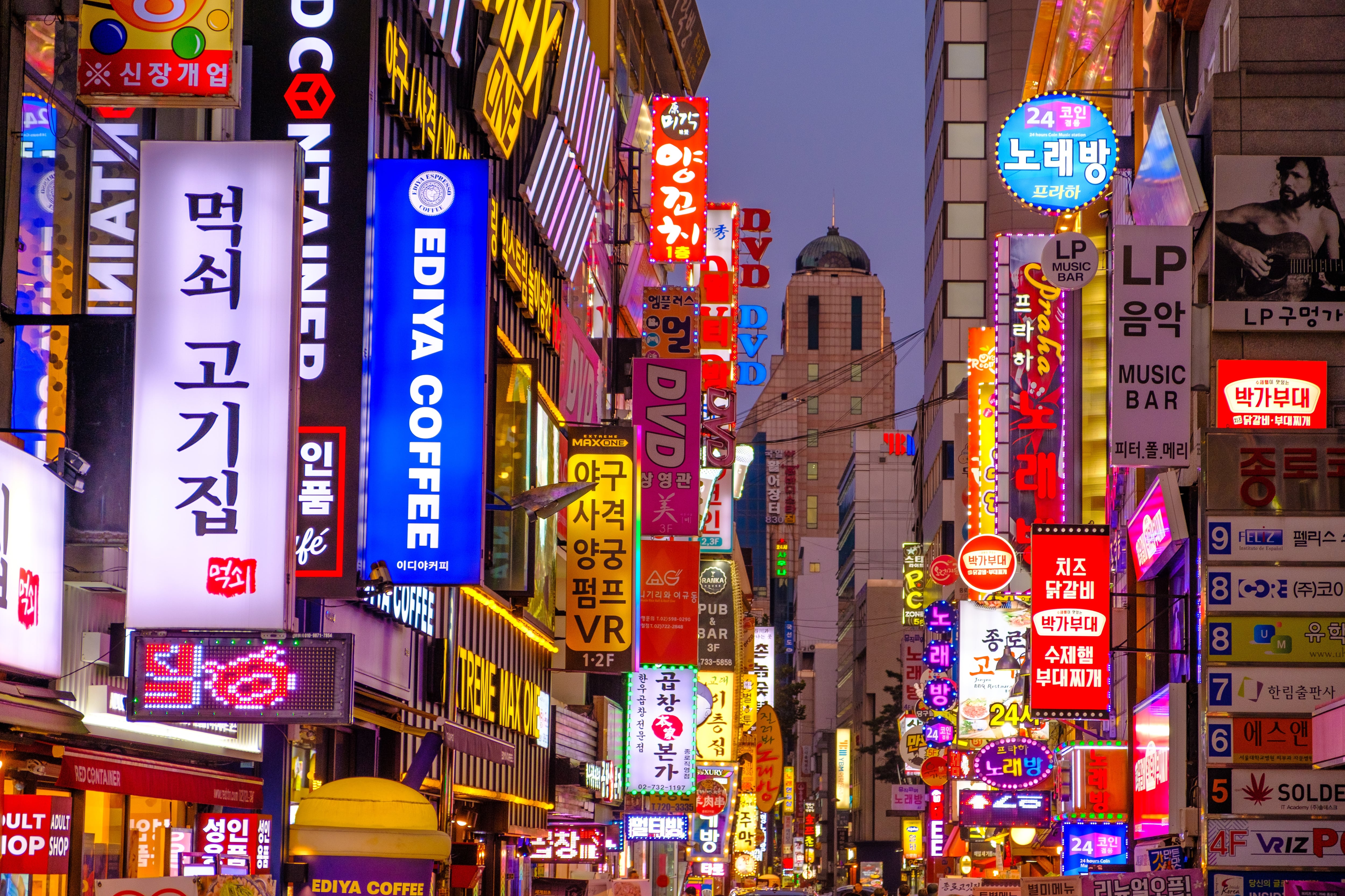 The bright neon lights and signage of the busy streets of Seoul, South Korea