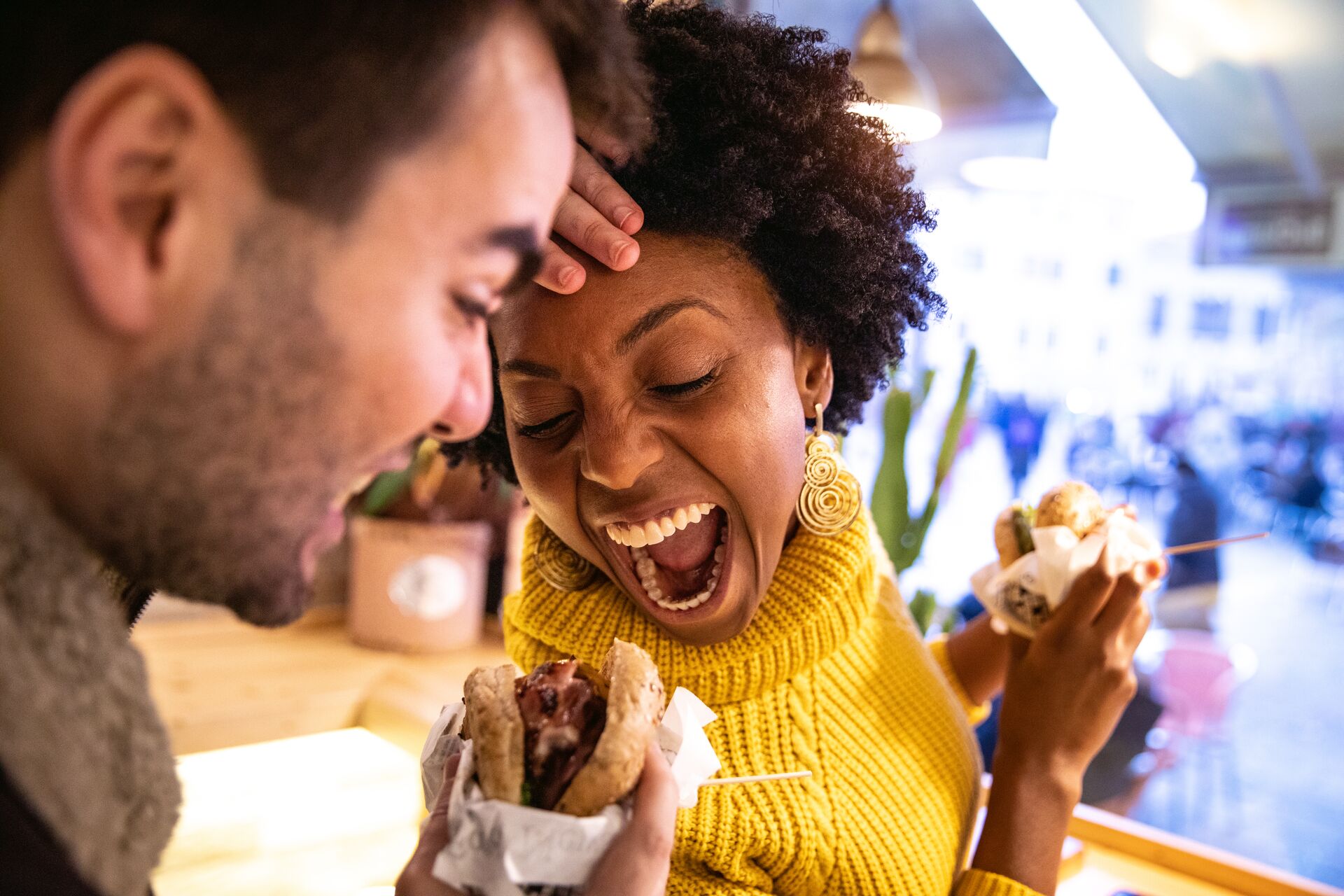 friends eating cheeseburgers in California