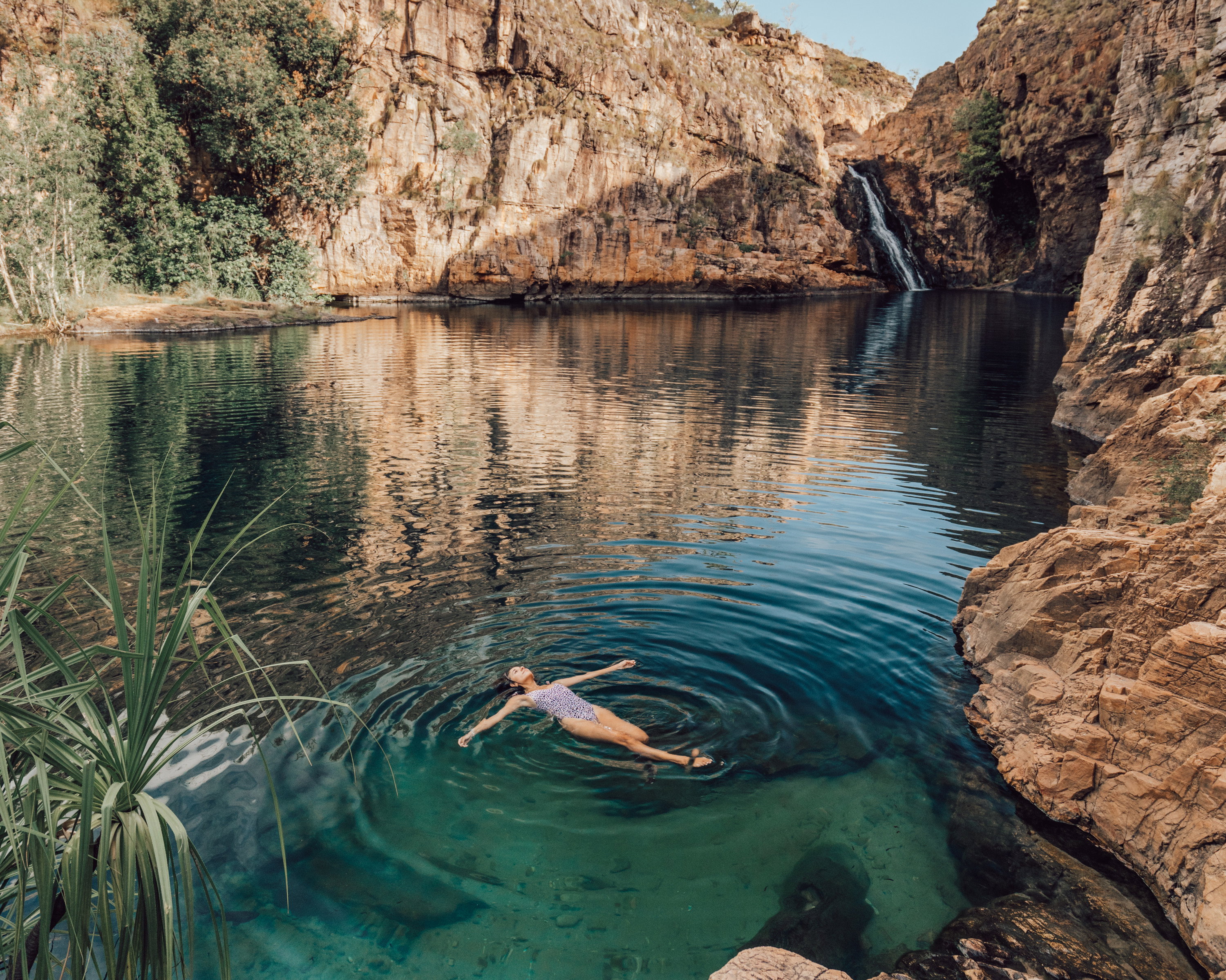 Girl relaxing at Barramundi Gorge, Australia
