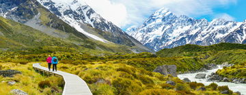 Tourists hiking on Hooker Valley Track in Mount Cook National Park, New Zealand