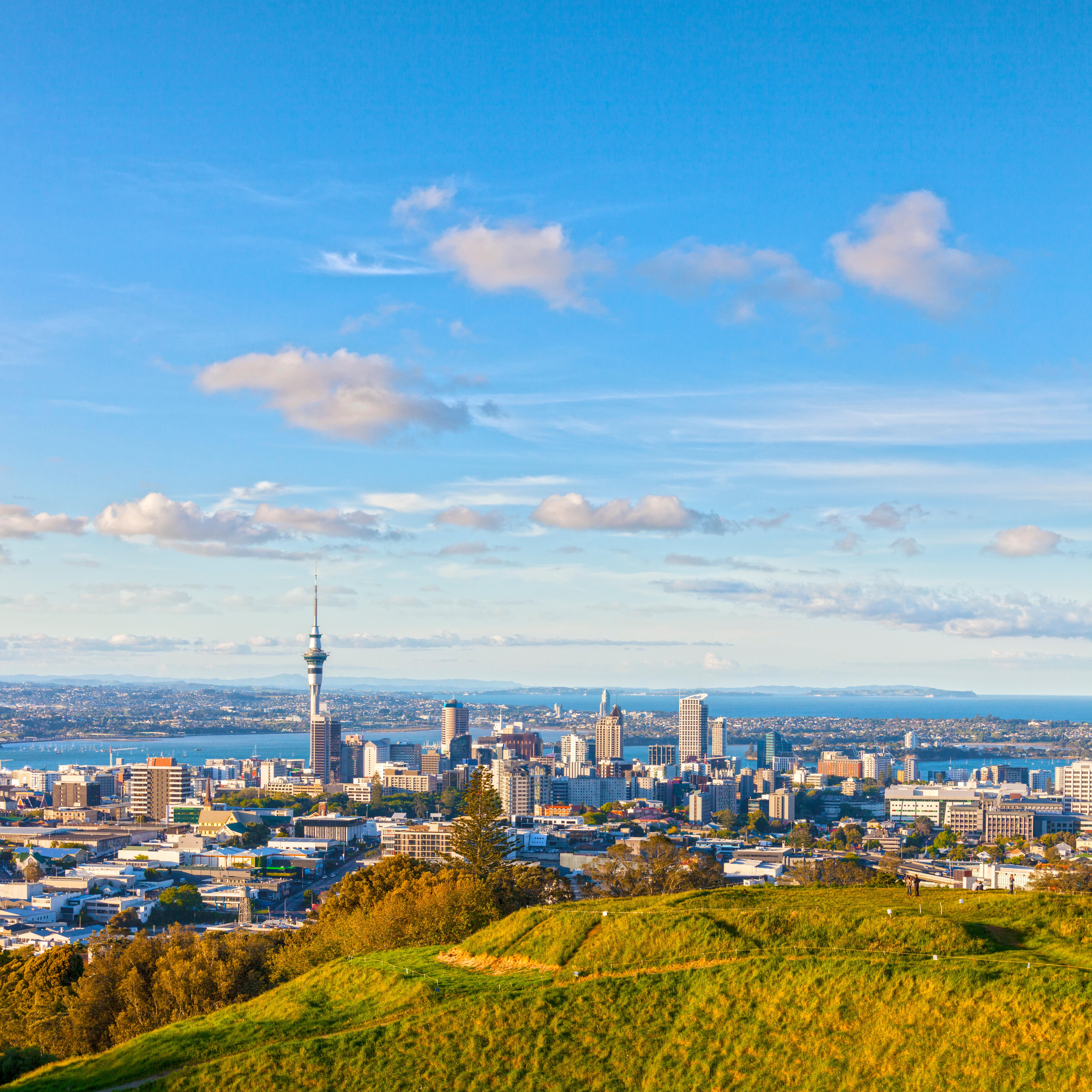 Auckland, New Zealand, from the volcano Mount Eden, the crater rim is in the foreground