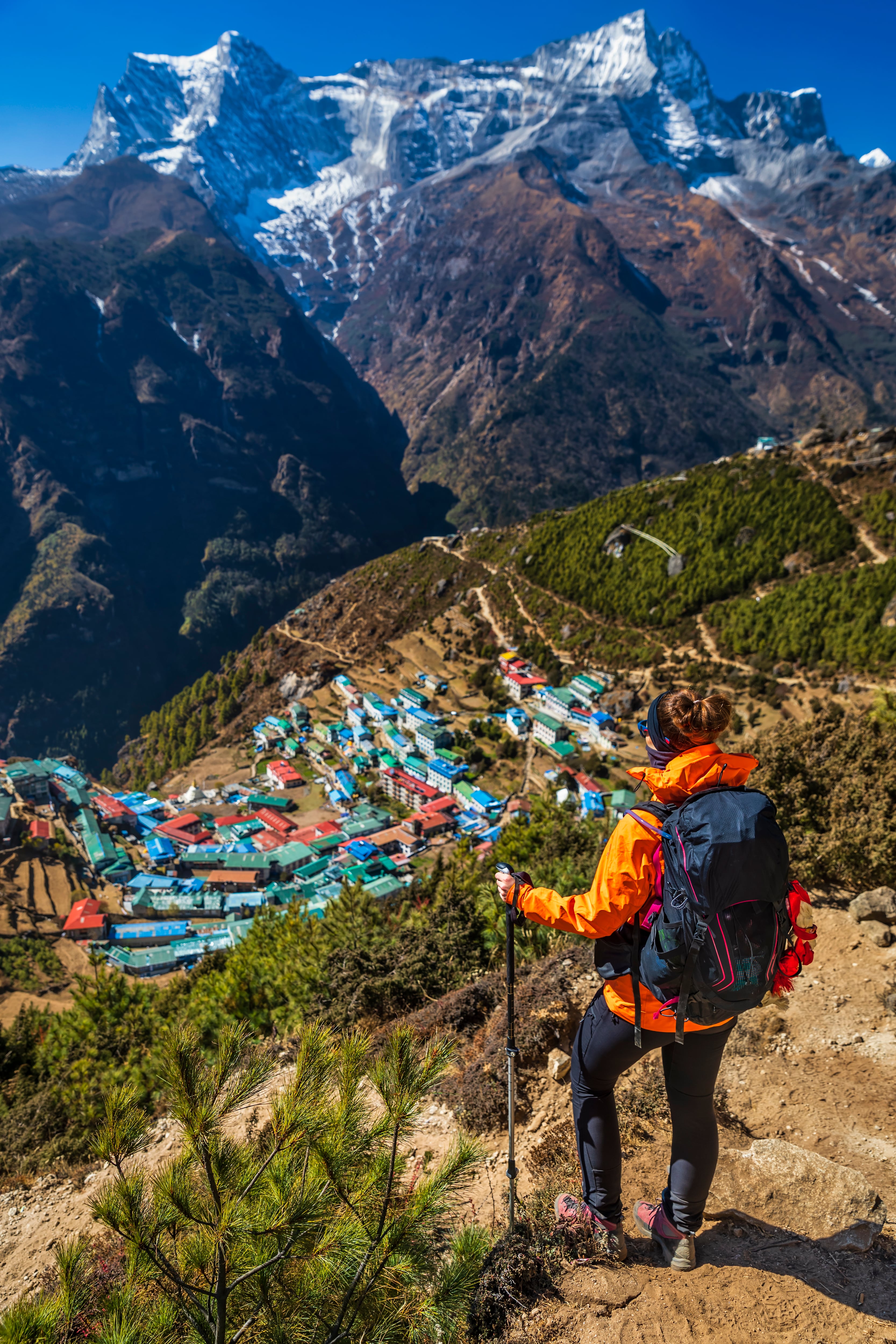 Woman looking at Namche Bazaar from above, Mount Everest National Park
