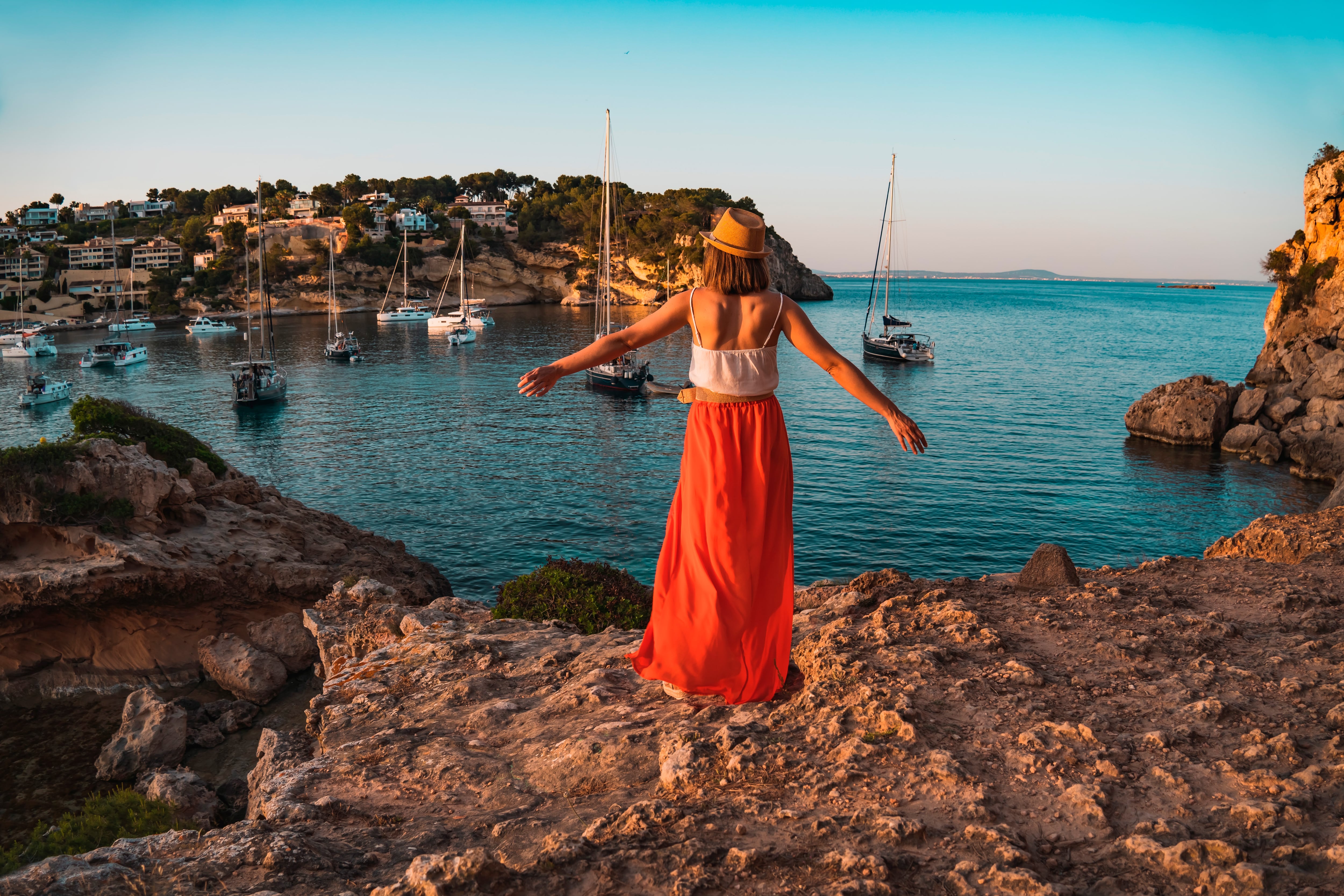 Young woman on holiday in the cove of Portal Vells, island of Palma de Mallorca, Spain
