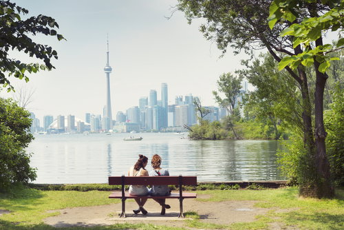 Two Girls sitting on the Bench, Toronto, Ontario, Canada