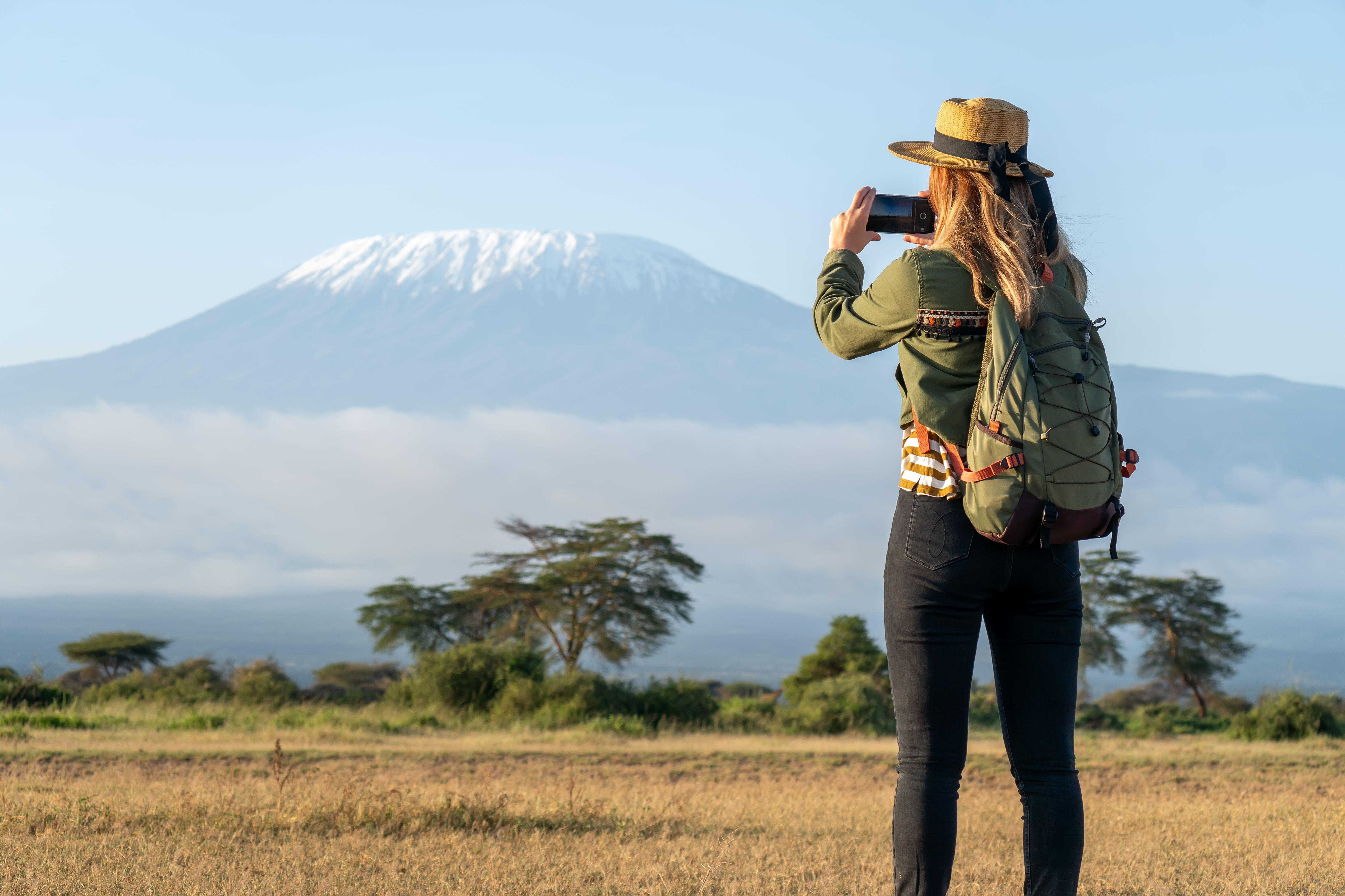 Young women against the backdrop of the Kilimanjaro volcano, Kenya