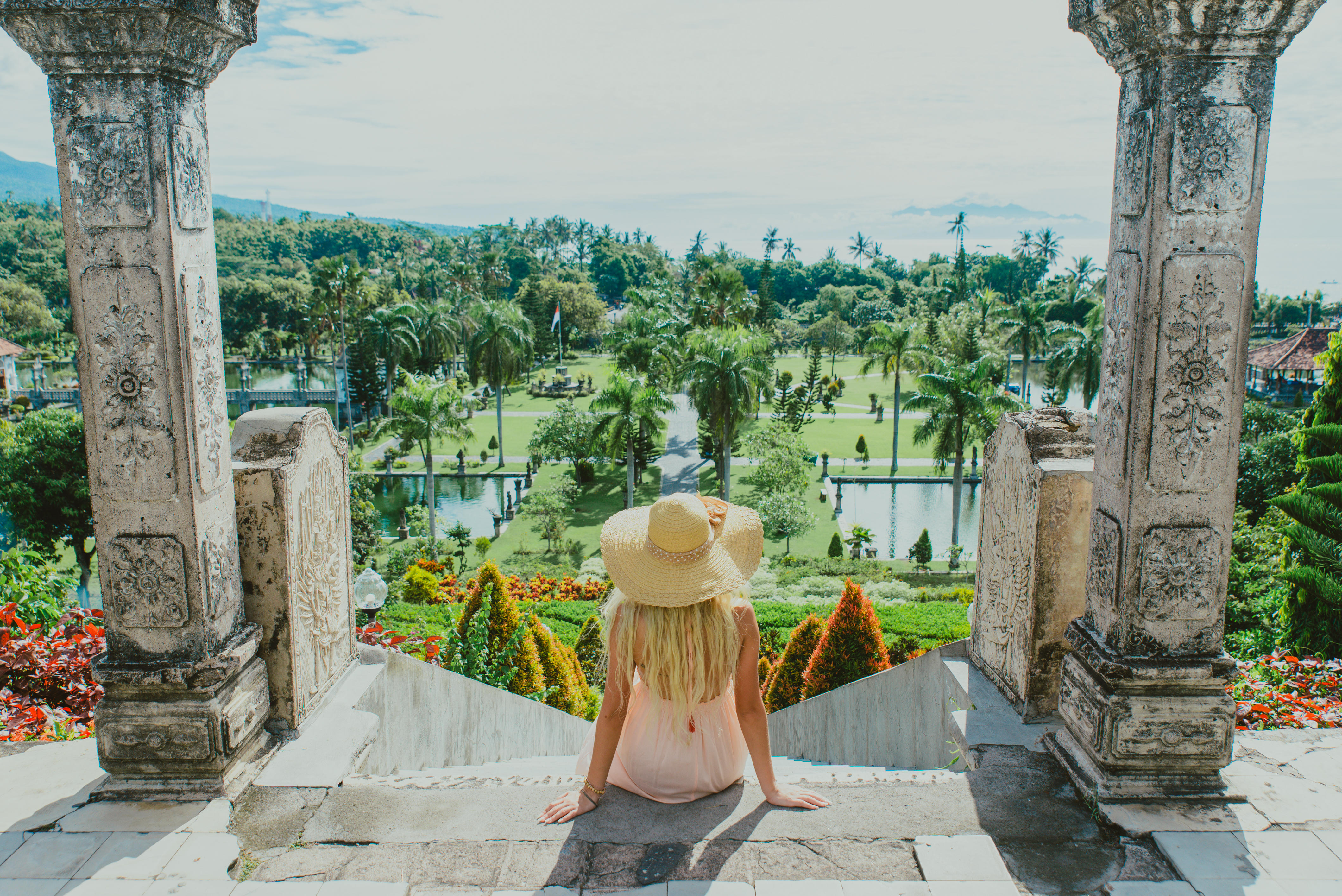 Young woman visiting the water palace in Bali, Indonesia