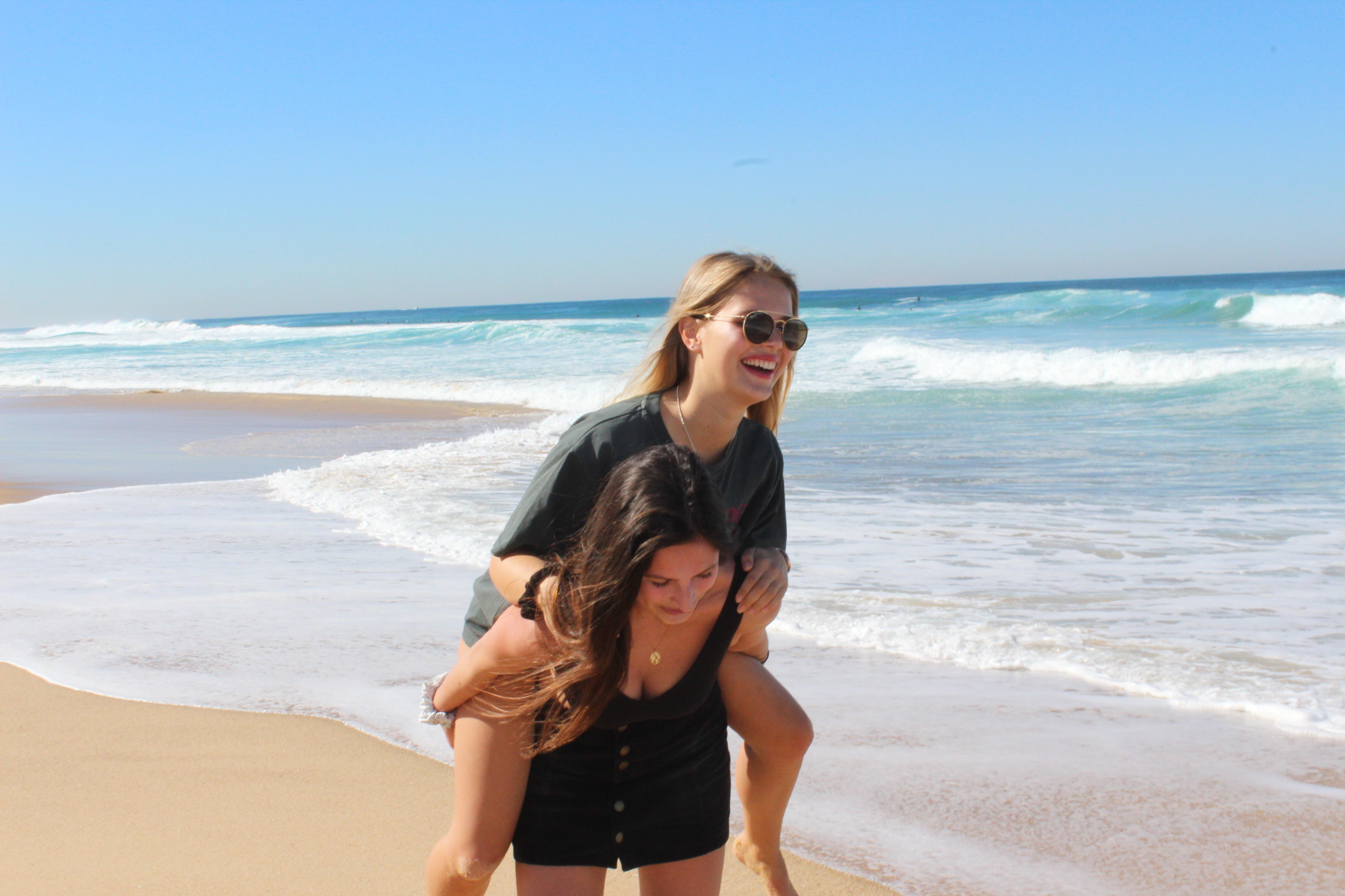 Girls having fun on the beach, Merewether beach in Newcastle Australia