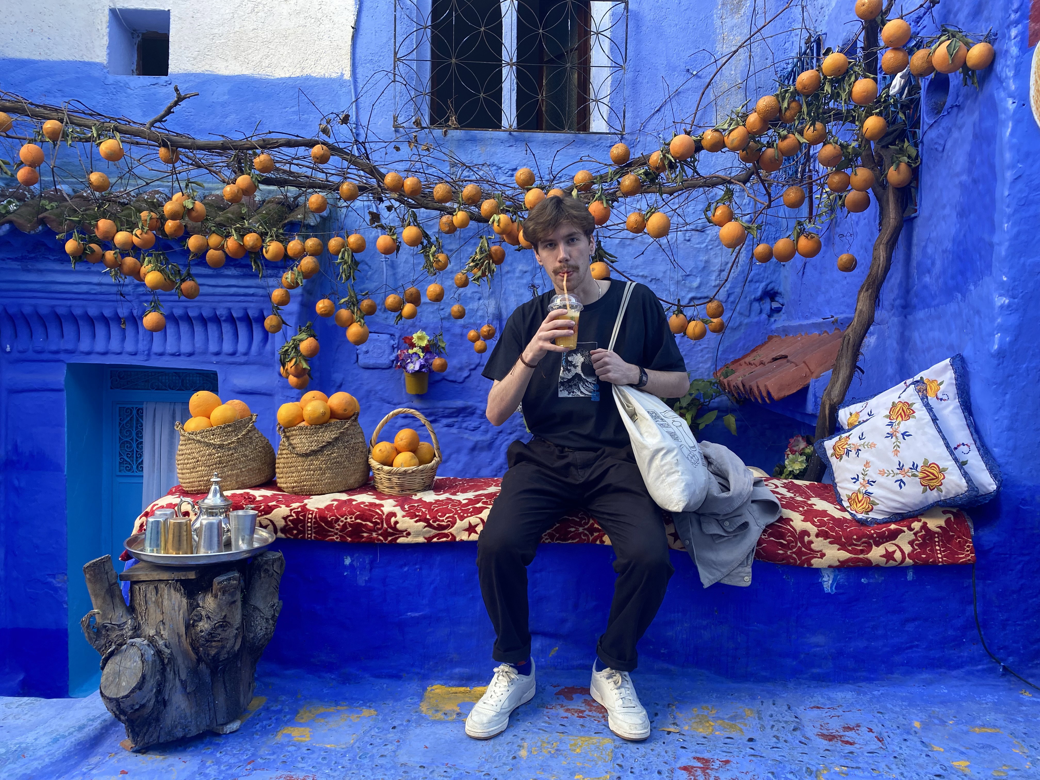 A man in Morocco drinking fresh orange juice
