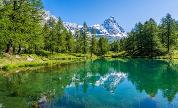 Idyllic morning view at the Blue Lake with the Matterhorn reflecting on the water, Valtournenche, Aosta Valley, Italy