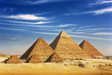 The Pyramid of Menkaure at Sunset and a camel nearby Egypt