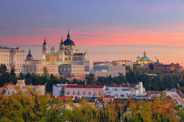 Madrid Skyline with Santa Maria la Real de La Almudena Cathedral and the Royal Palace during sunset