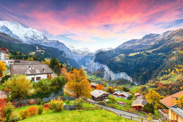 Stunning autumn view of picturesque alpine village Wengen with Jungfrau Mountain and Lauterbrunnen Valley on background. Location: Wengen village, Berner Oberland, Switzerland, Europe.