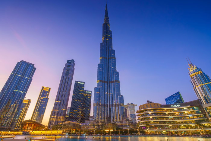 Burj Khalifa Tower from below, at nighttime with illumination and street lights, Dubai, United Arab Emirates