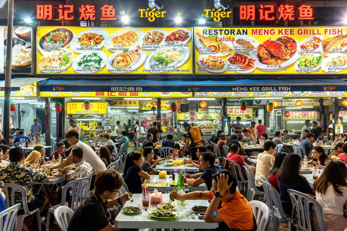 People eating at a restaurant along Jalan Alor, Kuala Lumpur's famous food street, Malaysia - asia asian beer bukit bintang chairs city conversation date dinner district drinking eating enjoying food friends inside interior jalan alor kuala lumpur malay malaysia malaysian male market men night life nighttime out outside people relaxing restaurant sitting street tables urban     Conditions of Usage Alamy Premium Image RF (Royalty Free) This image CAN be used for advertising! Royalty Free Royalty Free, all media in perpetuity, any size, any placement. Image ID: 2CTC8H6 Credit ©BisualPhoto/Alamy Status Public