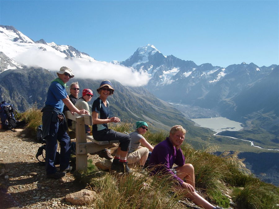 A group of trekkers up a mountain in New Zealand