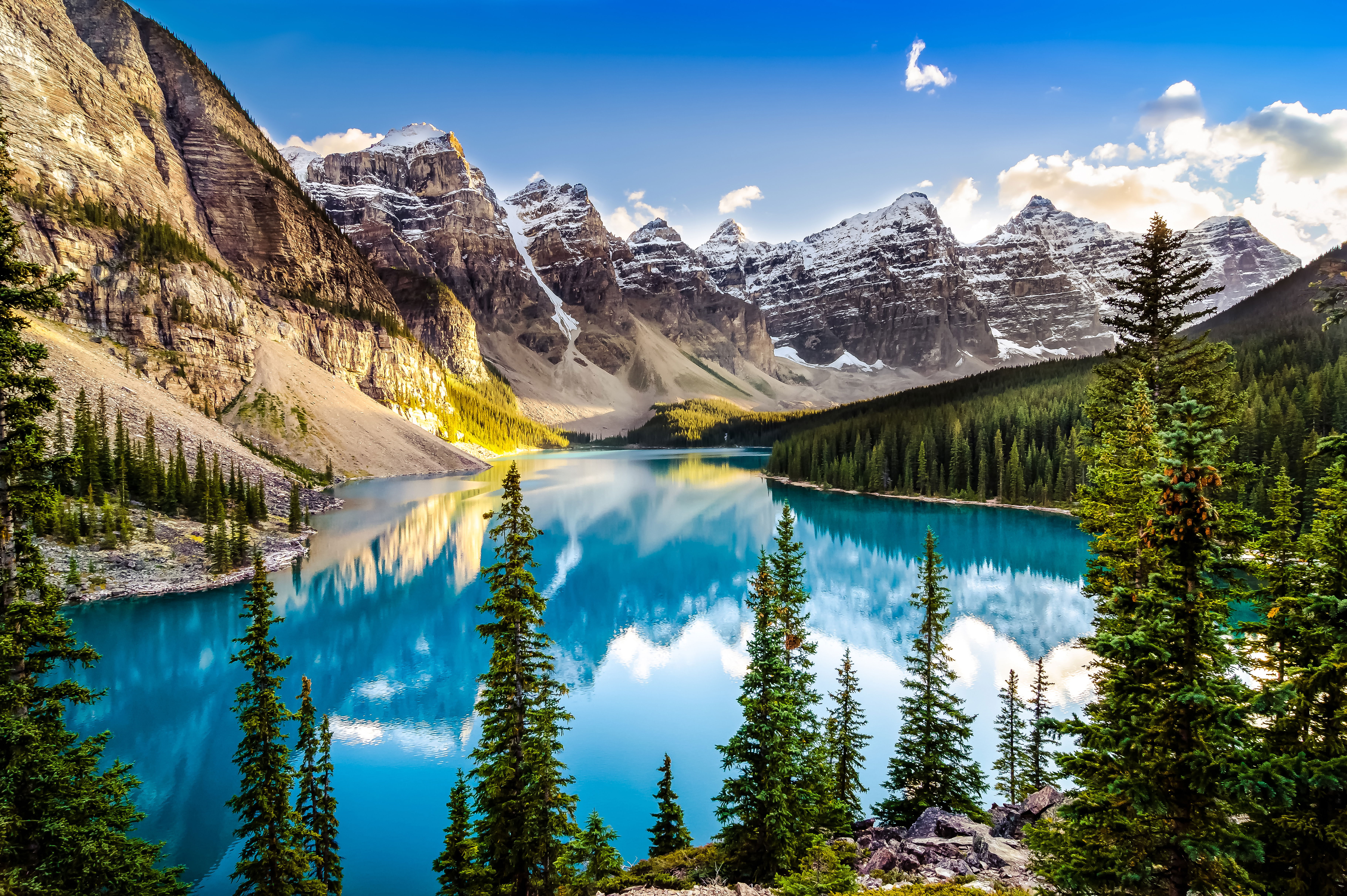 A car driving through the Rocky Mountains in Canada