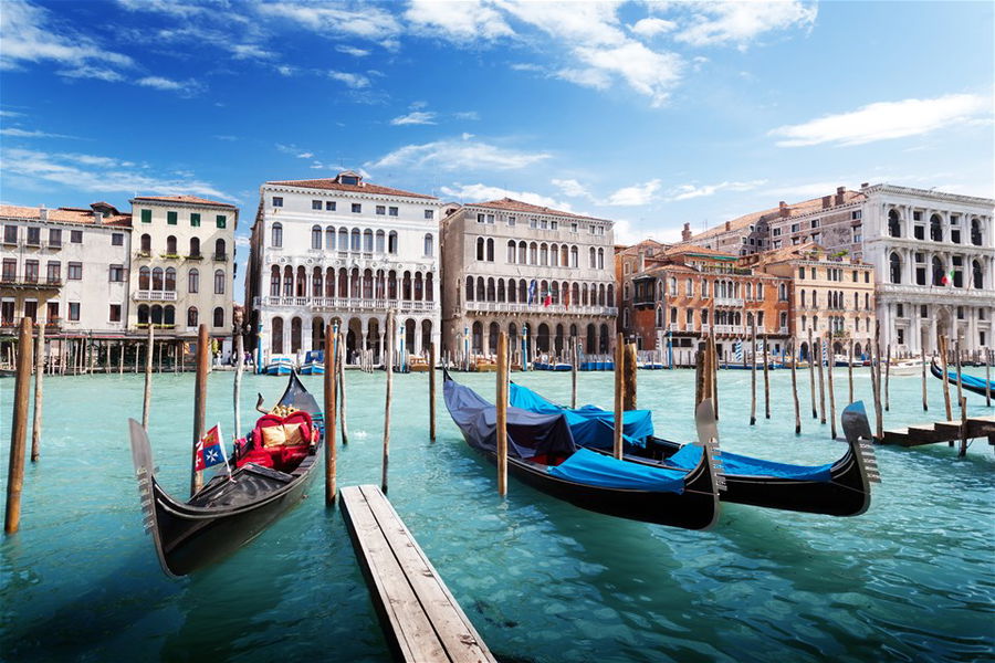 Boats line the canal in Venice, Italy